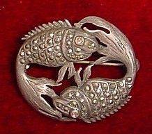Pisces vintage pin on red background